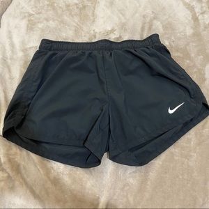 Black Nike running shorts